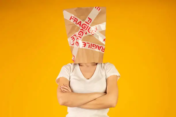 Woman is wearing a paper bag.