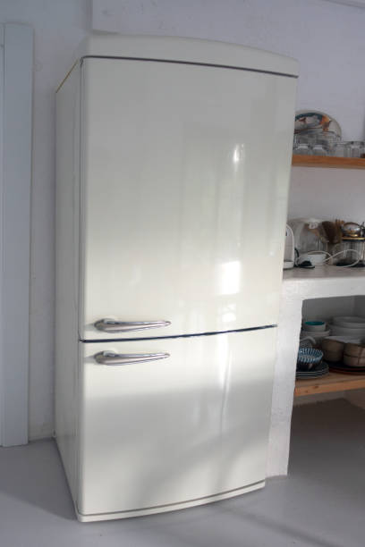 istock Retro style white fridge in vintage kitchen 1399757587