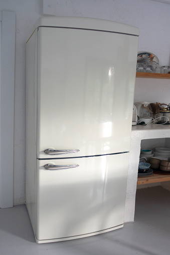 Retro style white fridge in vintage kitchen