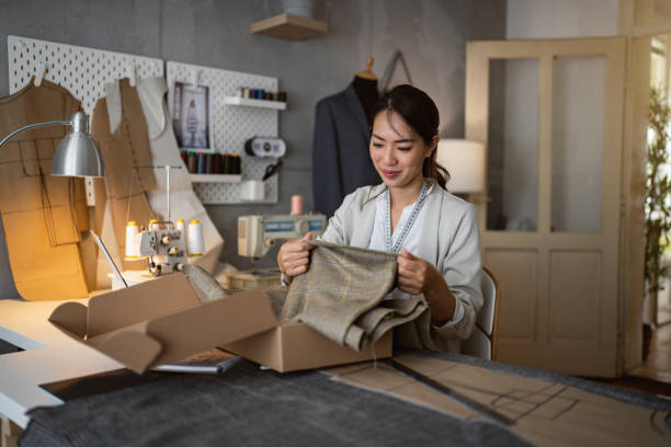 istock Female small business owner packing the orders into cardboard box 1399757777