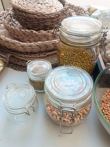 Various dry legumes in a glass jars
