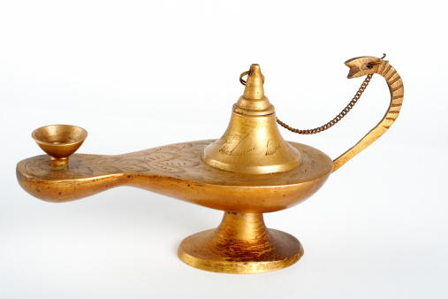 An old brass oil lamp on white background