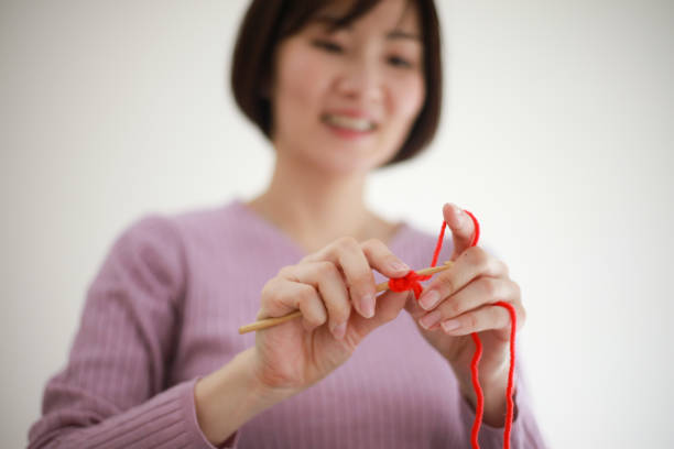 istock Image of a woman knitting 1399762041