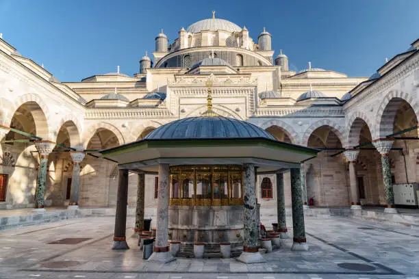 Awesome view of ablution fountain in the middle of courtyard of the Bayezid II Mosque in Istanbul, Turkey. The mosque is a popular destination among pilgrims and tourists of the world.