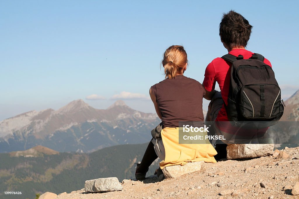 Couple Sitting and Looking Over Mountains http://www.ufnal.pl/~bolek/feliks.szewczyk.info/foty/album35/peopleoutdoors.jpg Adult Stock Photo