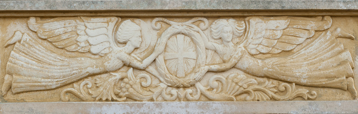 The stone bas-relief with flying angels