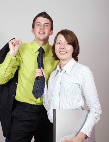 Man with tie and woman with laptop.