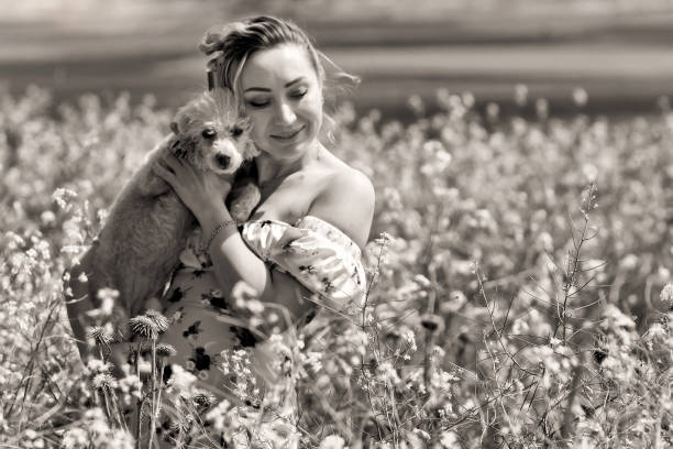 Happy Young Woman at Fields in Springtime
