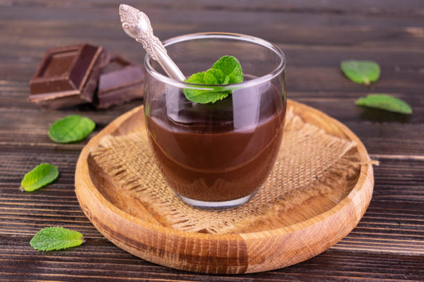 istock Chocolate pudding or in a glass on a wooden tray. 1399765857