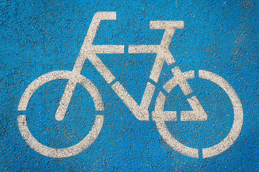 Red bicycle road and a sidewalk textures background