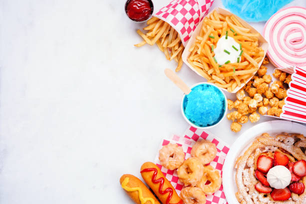 istock Carnival theme food side border on a white marble background 1399768081