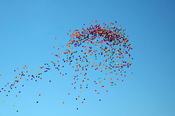 Fly away Balloons rising up in the sky alintal stock pictures, royalty-free photos & images