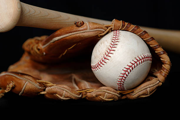 istock Baseball . Bat and Glove on black 139976857