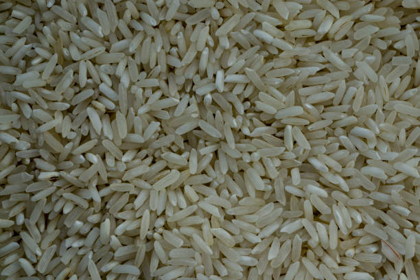 istock White rice. Texture background of white rice groats. 1399768914