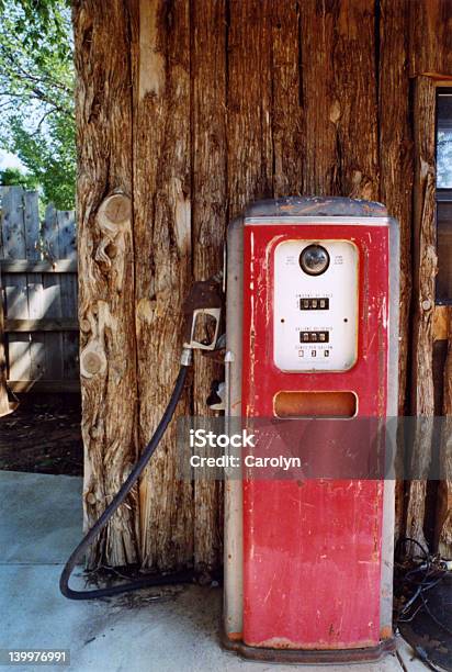 Antique Gas Pump With Log Wall Stock Photo - Download Image Now - Antique, Collection, Fuel Pump