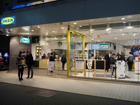 Tokyo,Japan.December 2020:The exterior of the IKEA interior shop in Shibuya. The entrance is crowded with shoppers.View from the road.