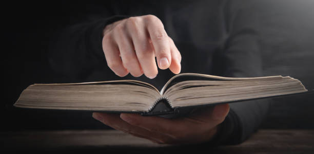 istock Caucasian man reading the Holy Bible. 1399770141