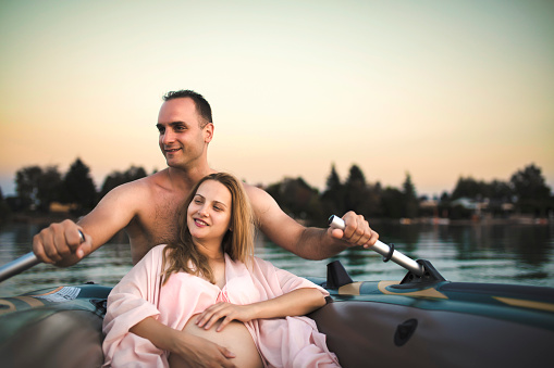 Romantic couple relaxing in the water boat