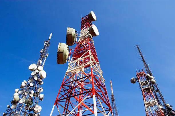 Photo of Telecommunications Tower, blu skye with clouds