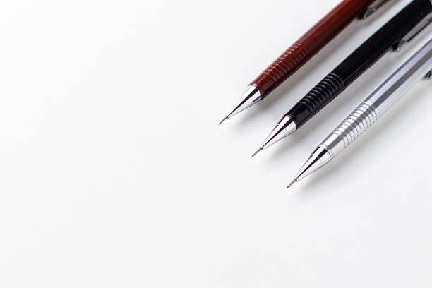 Group with three mechanical pencils for technical drawing of architecture and civil engineering, on a white background.