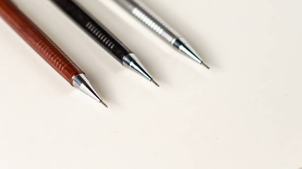 istock Three mechanical pencils of different sizes on the white background. 1399771466