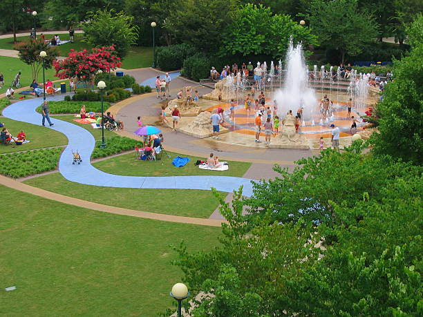 Aerial view of green public park in Chattanooga, Tennessee with children playing in fountain