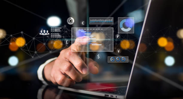 istock On his left hand, a man in a suit holds a cell phone. On a rapidly expanding stock chart, his right hand point. Background of a globe with hazy lights 1399773371
