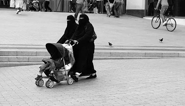 Muslim Women with Child in Stroller, Ilford Delta 100.