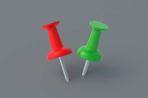 Two different color push pins on gray background. Stationery tools. Office equipment. School education. 3d render