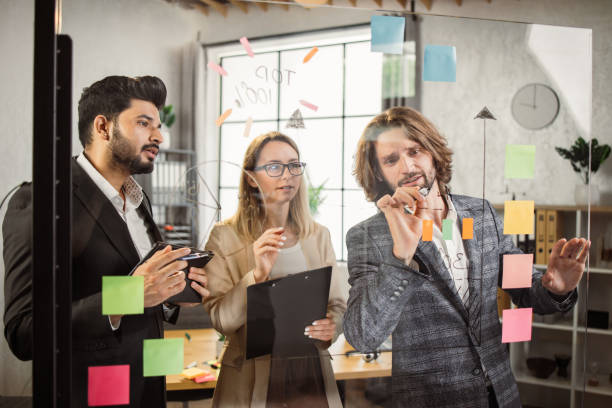 istock Business people having brainstorm session in boardroom 1399777089
