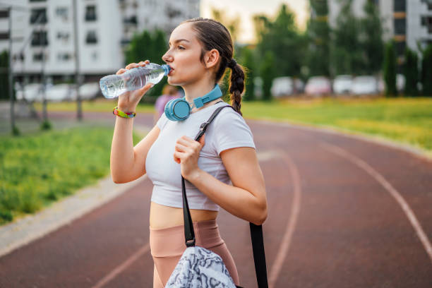 istock Sporty woman relaxing after workout 1399777192