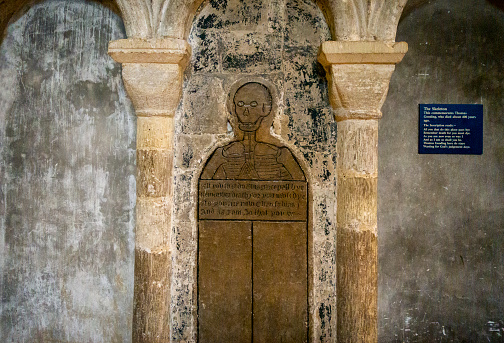 Memorial brass in Norwich Cathedral, in Norwich, Norfolk, Eastern England. It commemorates Thomas Gooding and bears the grim warning, ‘All you that do this place pass bye: Remember death for you must dye: As you are now even so was I: And as I am so that you be: Thomas Gooding here do staye: Wayting for God’s judgement daye’. It attracts the attention of many fascinated and horriefied tourists!