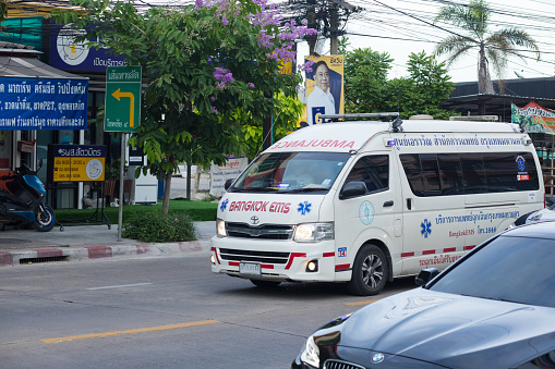 Driving Thai ambulance on emergency in Bangkok Ladprao on Wanghin Road