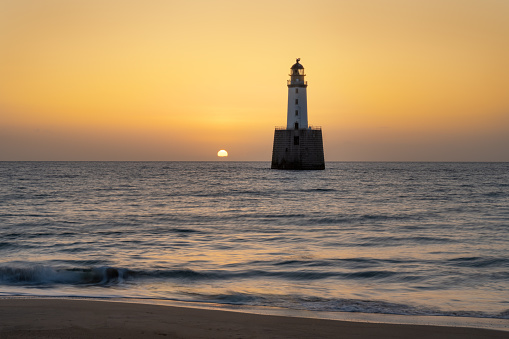 Silhouette of Rattray Head Lighthouse at sunrise Scotland