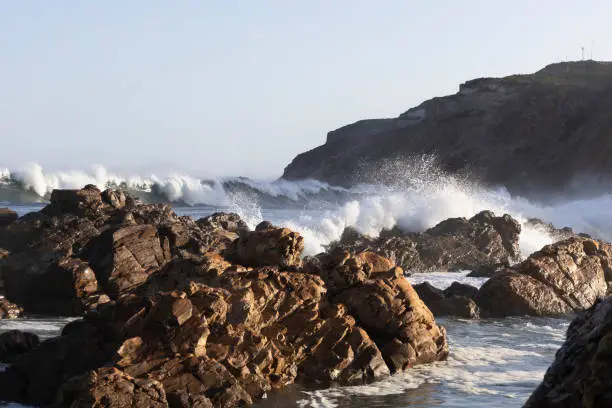 Waves crashing on the rocks at Mossel Bay on the Garden Route of South Africa