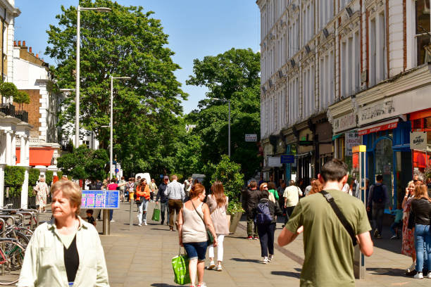 People wandering around posh part of London during working hours on a Friday