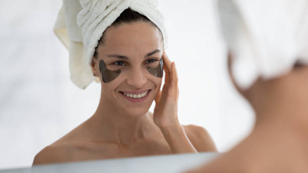 istock Happy young latin woman applying hydrogel patches. 1399779988