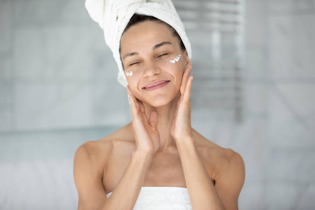 istock Happy beautiful young hispanic woman applying moisturizing creme. 1399779993
