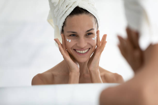 istock Happy young hispanic woman applying cream. 1399780058