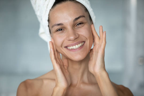 istock Beautiful smiling young hispanic latin woman touching face. 1399780068