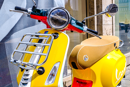 Siena, Italy - April 6:typical italian Vespa Motorscooter (build from Piaggio) at a street in Siena on April 6, 2022