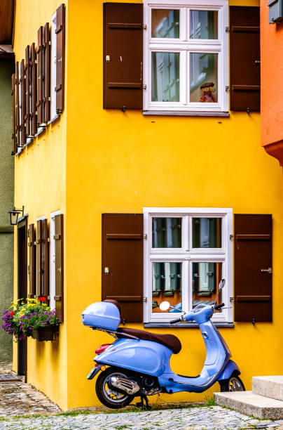 Siena, Italy - August 2:typical italian Vespa Motorscooter (build from Piaggio) at a street in Siena on August 2, 2019