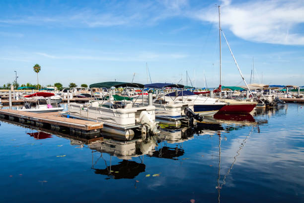Blue skies over blue waters in this crowded marina on East Lake Toho in St Cloud, Florida stock photo