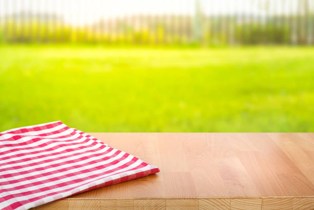 istock Table and fabric,cloth and blur green lawn background 1399782885