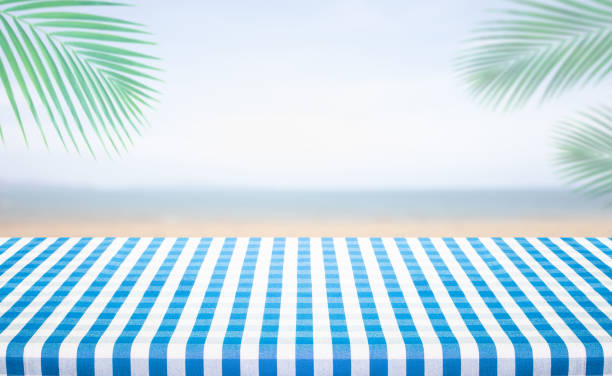 Checkered tablecloth texture with sea view background.For montage product display or design key visual layout.Holiday summer concepts