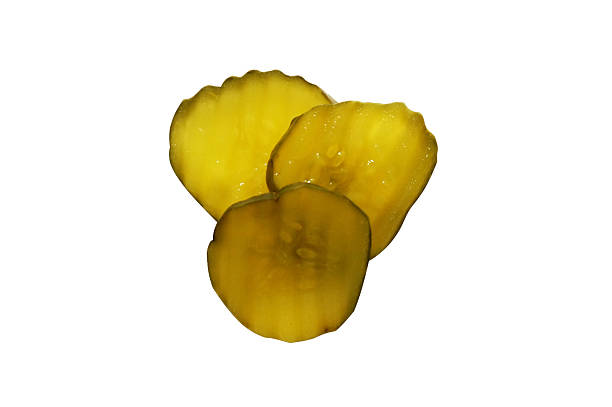 Sliced Pickles Isolated Three pickle slices. Isolated image with clipping path. dill pickle stock pictures, royalty-free photos & images