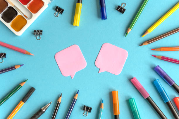 istock Many stationary supplies on blue background with space for text. Office accessories flat lay 1399784964