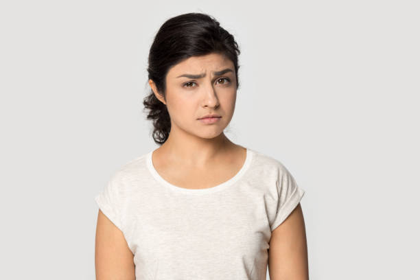 istock Unhappy Indian woman look at camera feeling distressed 1399786356