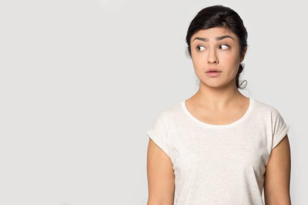 istock Indian woman look at empty copy space 1399788075