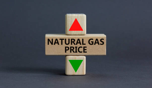 symbol for increasing or decreasing price for natural gas. a cube symbolizing natural gas price level. beautiful grey background. business and natural gas price concept. copy space. - liquid natural gas imagens e fotografias de stock
